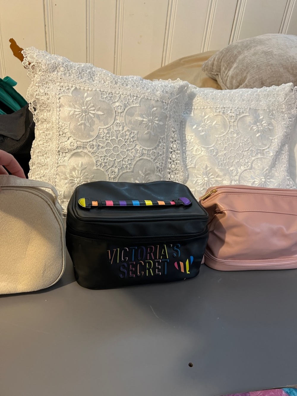 Lot of three cosmetic bags: Victoria's Secret, Bvlgari, and Nikoo.